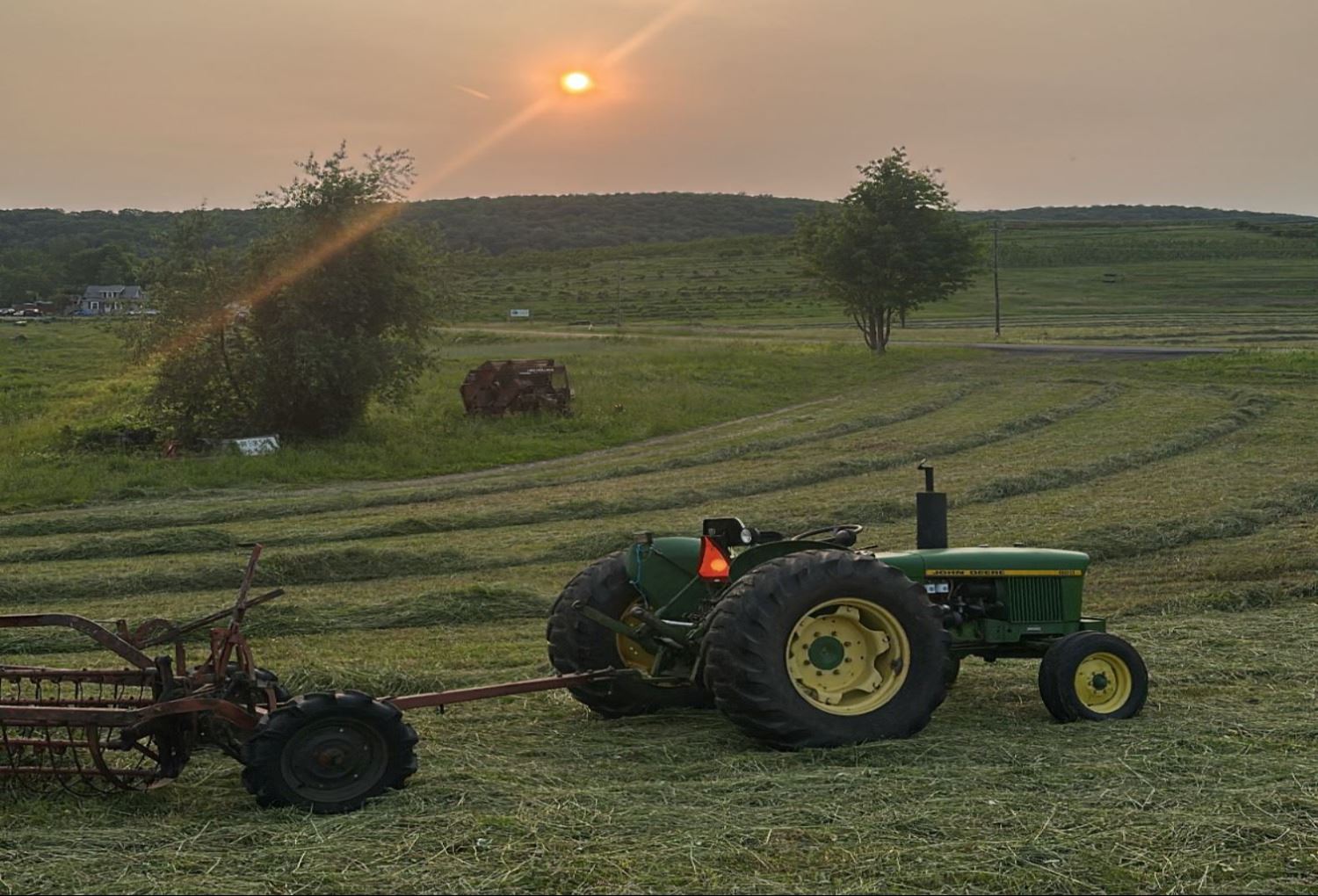 Tractor on a Field at Sunset